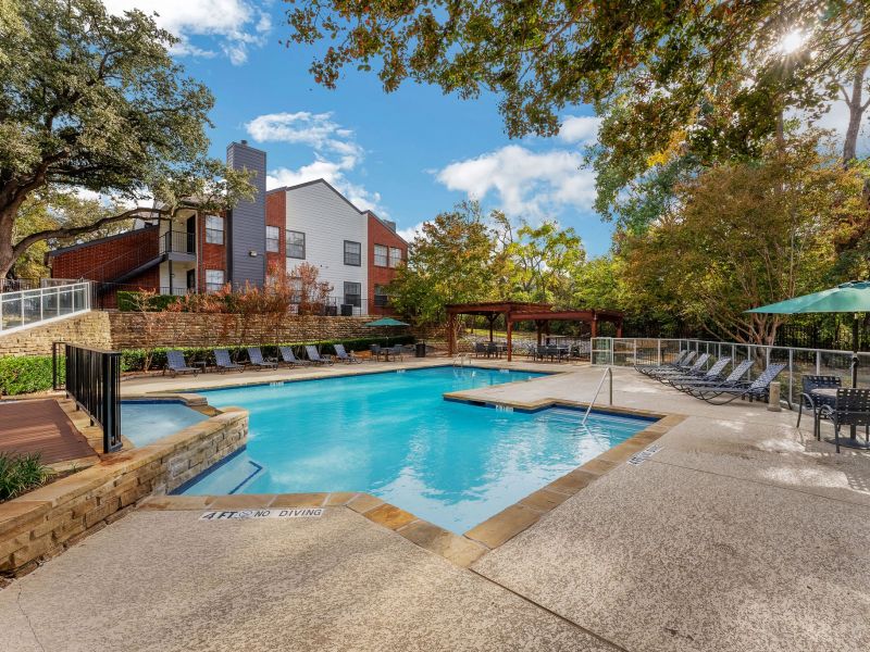 Crossings on marsh apartments exterior pool amenity with seating around the pool