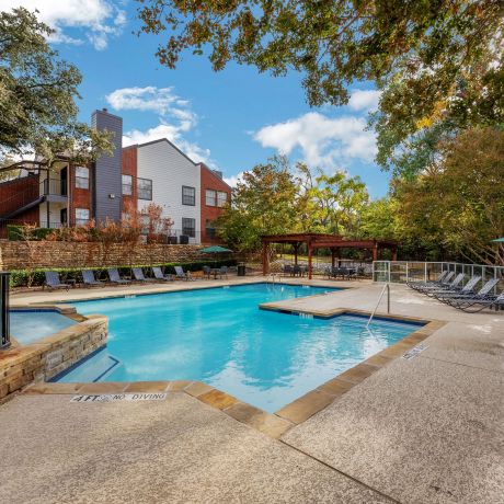 Crossings on marsh apartments exterior pool amenity with seating around the pool