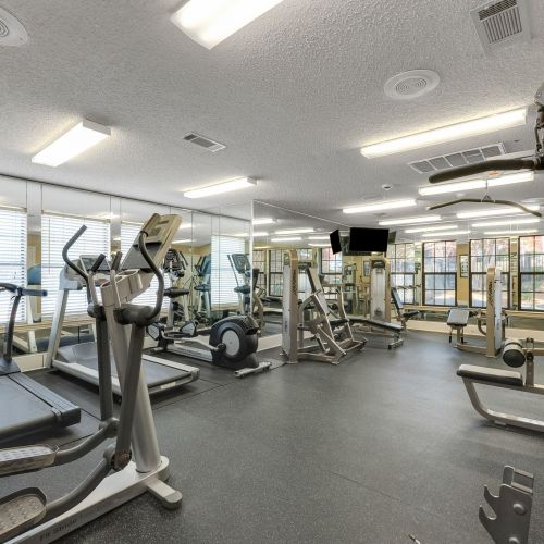 Crossings on marsh apartment gym with weight lifting equipment